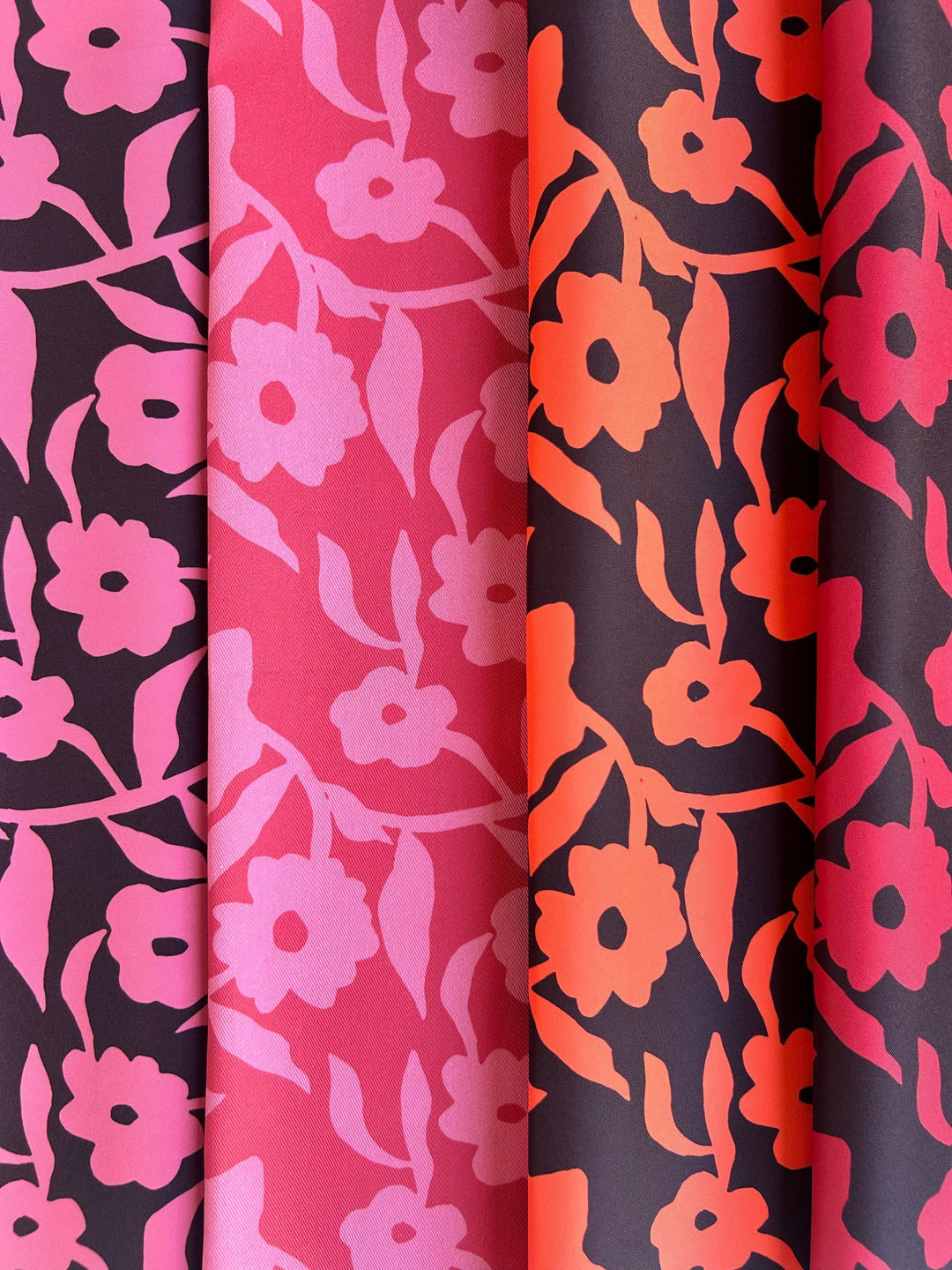 Bold pink orange and red floral fabric for upholstery