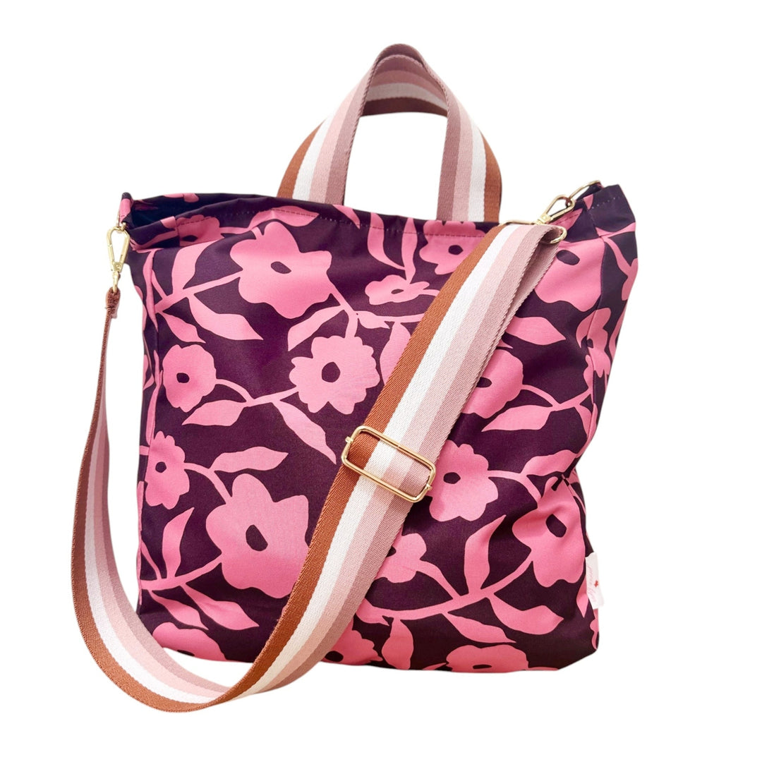 Floral-patterned tote bag with pink flowers on a brown background