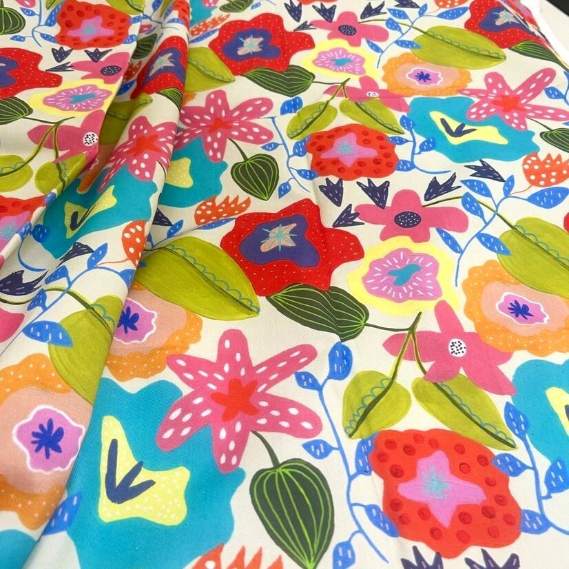 Colorful floral patterned fabric perfect for vibrant upholstery projects.